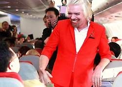 Sir Richard Branson works AirAsia flight