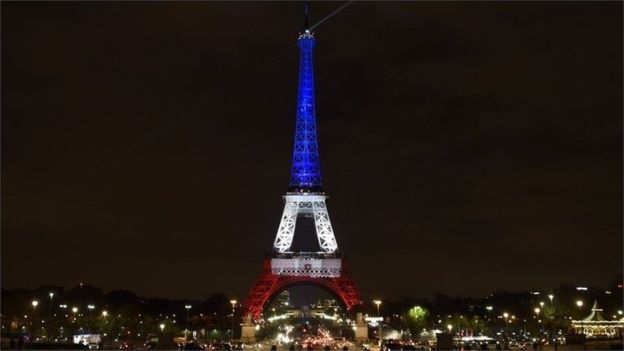 Eiffel Tower lit up in France’s national colors to honor terror victims