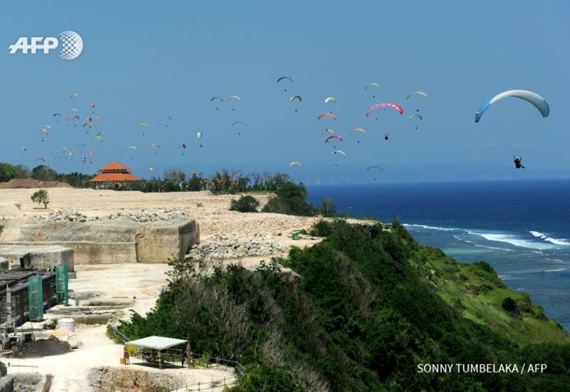 Paragliders in Indonesia’s Bali island