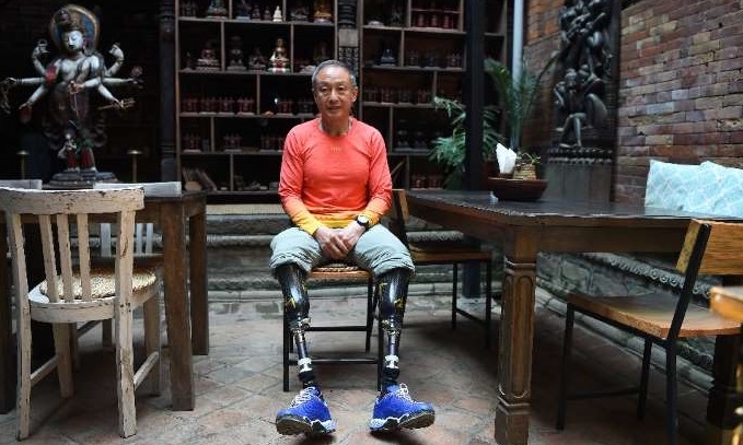 Chinese double amputee finally summits Everest, decades after first bid