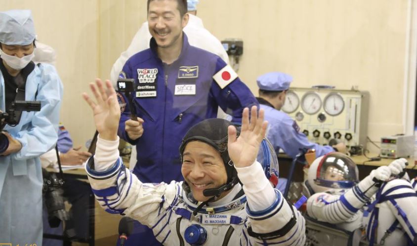 Japanese tourists dock at International Space Station