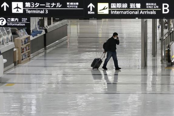 Japan suspends new flight reservations